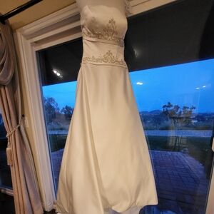 Elegant Ivory Wedding Gown with Embellished Waist and Train with French Bustle